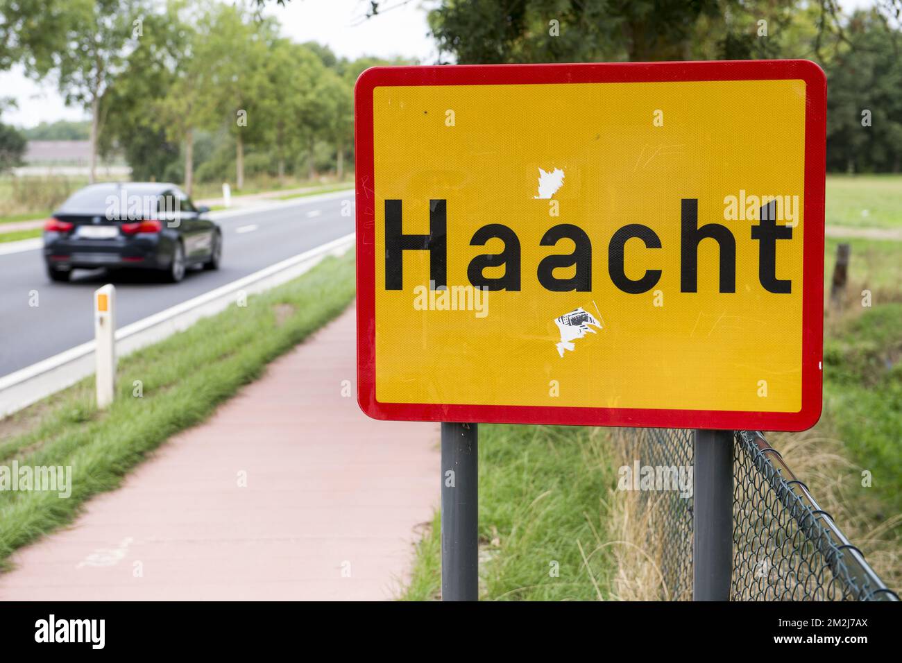 Illustration shows the name of the Haacht municipality on a road sign ...