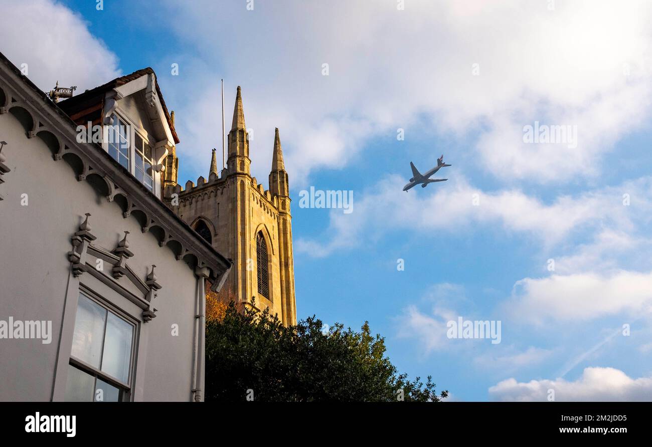A plane flies over  Royal Windsor Berkshire , England , UK Stock Photo