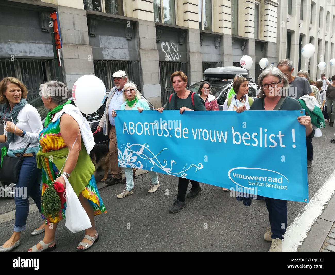Women carry a banner that reads 'Abortus: de vrouw beslist' (Abortian, the woman decides), during a protest pro abortion, organised by the 'Collectif des 350', in Brussels, Sunday 09 September 2018. The participants demand that abortion is properly depenalised and becomes a right for women. They claim the upcoming change of the abortion law is not going far enough. BELGA PHOTO ANTONY GEVAERT  Stock Photo