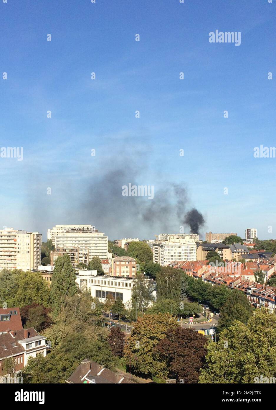 Black smoke rises from an appartment building in the Avenue Ciceron