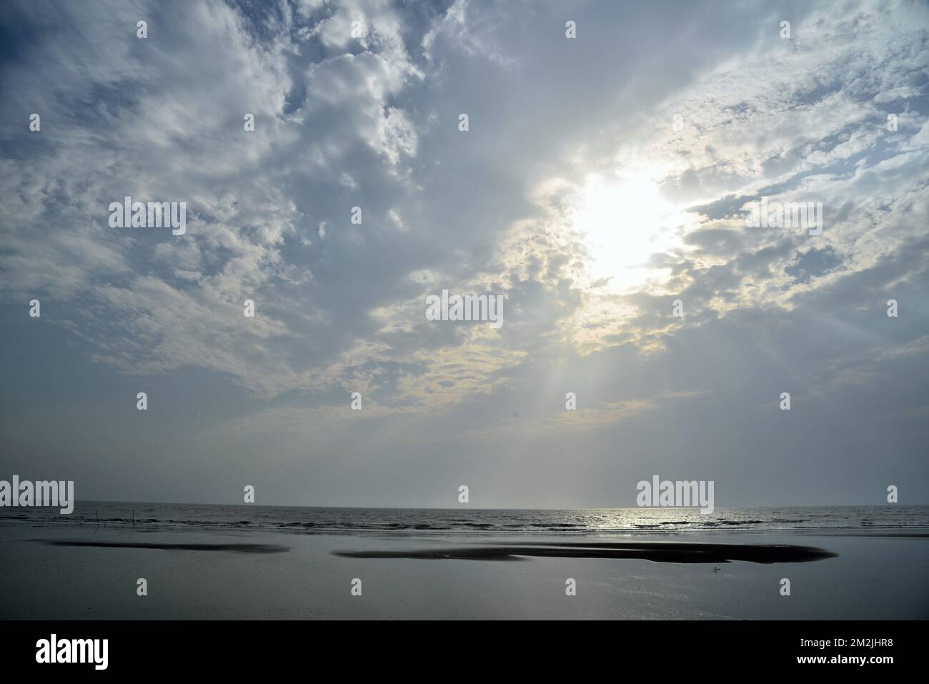 Sunset, sunlight, sunburst, sunrays, sunbeam, Surwada beach, Valsad, Gujarat, India, Asia Stock Photo