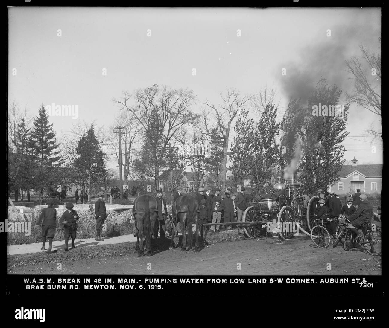 Distribution Department, Weston Aqueduct Supply Mains, break in 48-inch main, pumping water from low land at southwest corner of Auburn Street and Brae Burn Road, Newton, Mass., Nov. 6, 1915 , waterworks, pipes conduits, construction sites, bicycles Stock Photo