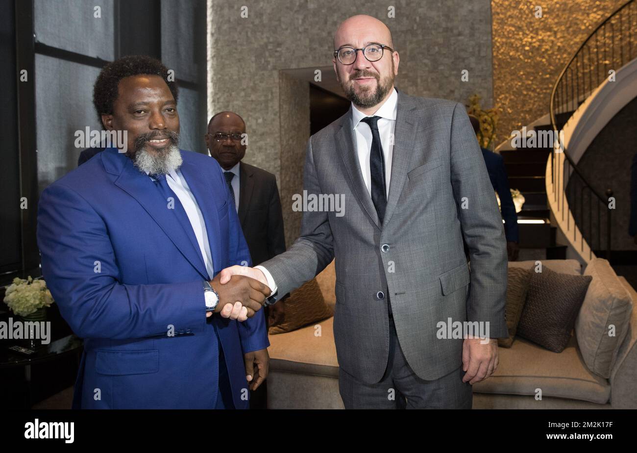 DR Congo President Joseph Kabila (L) and Foreign Minister Leonard She Okitundu welcome Belgian Prime Minister Charles Michel prior a meeting during the 73th session of the United Nations General Assembly (UNGA 73), in New York City, United States of America, Friday 28 September 2018. BELGA PHOTO BENOIT DOPPAGNE Stock Photo