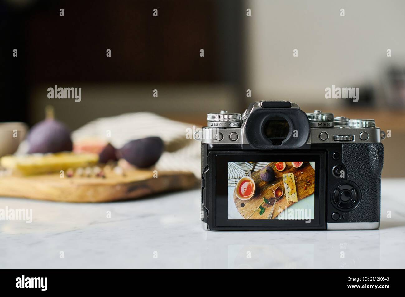 Close-up of professional digital photo camera with photo of food on the screen Stock Photo