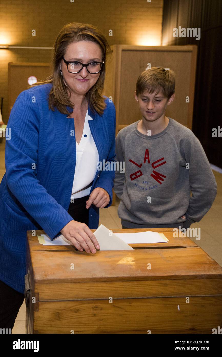Gwendolyn Rutten pictured with her son Alphonse as she casts her vote ...