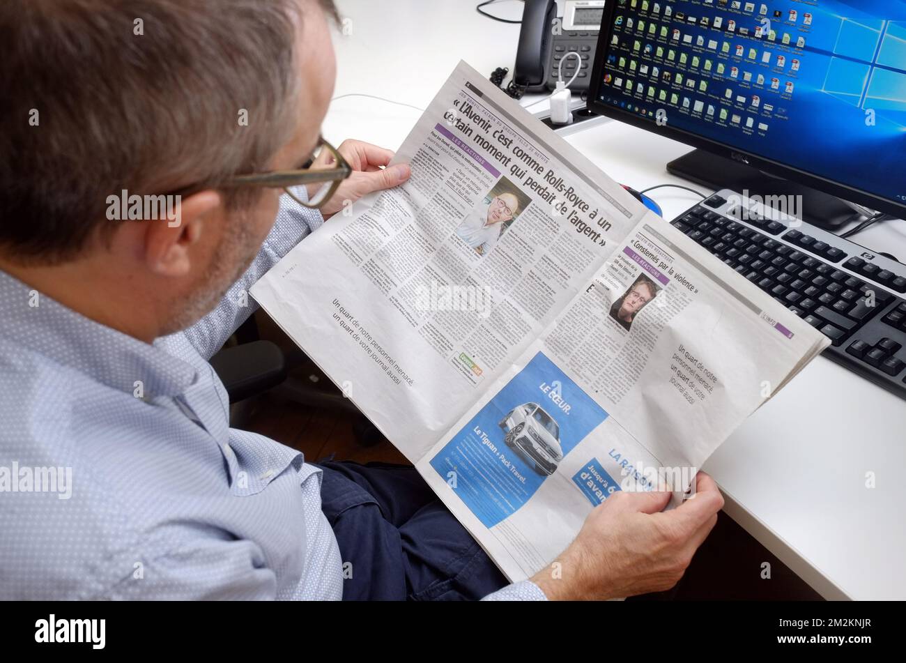 Illustration shows a man reading this Wednesday 24 October edition of