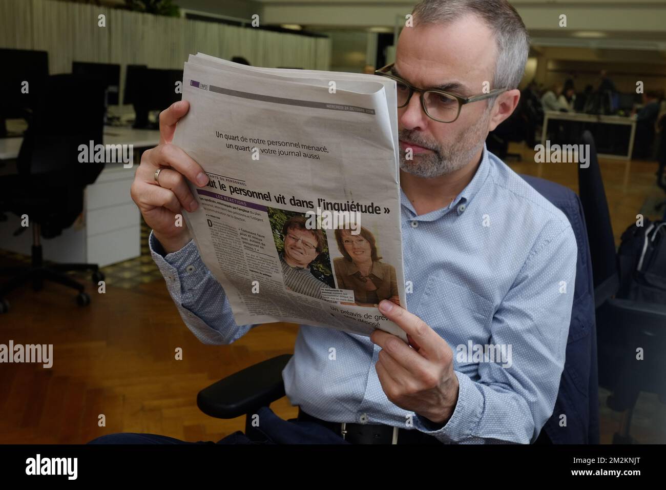 Illustration shows a man reading this Wednesday 24 October edition of