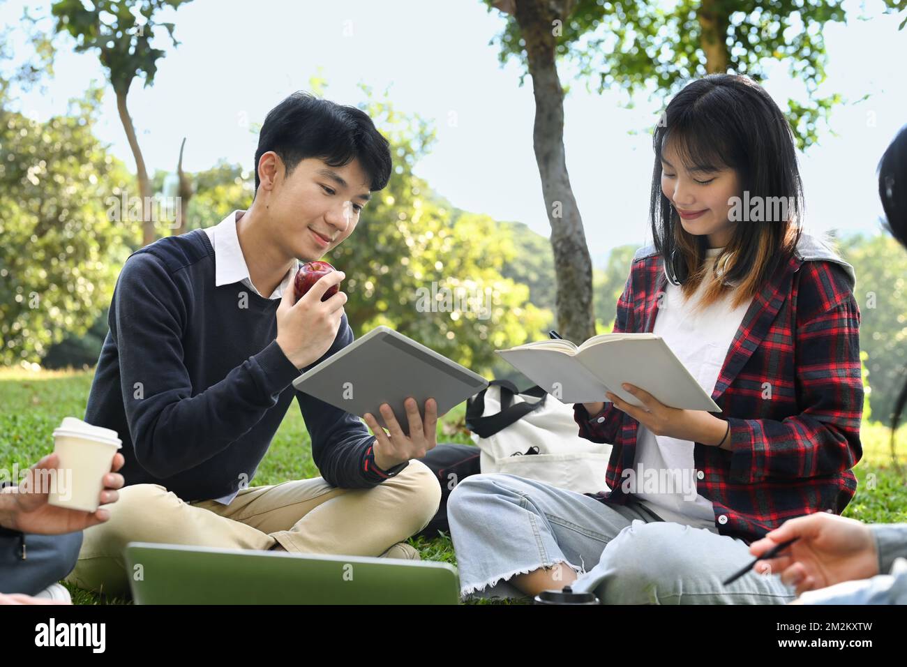 Image of university students chatting with each other after class while ...