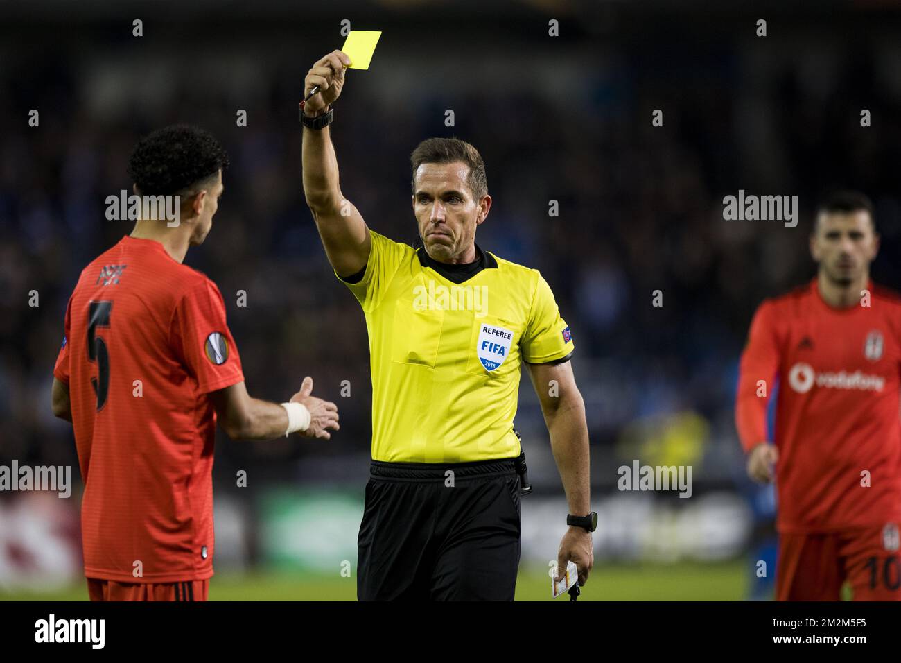 Besiktas' Kepler Laveran Lima Ferreira Pepe receives a yellow card from referee Tobias Stieler during a match between Belgian soccer team KRC Genk and Turkish club Besiktas, in Genk, Thursday 08 November 2018 on day four of the UEFA Europa League group stage, in group I. BELGA PHOTO JASPER JACOBS Stock Photo
