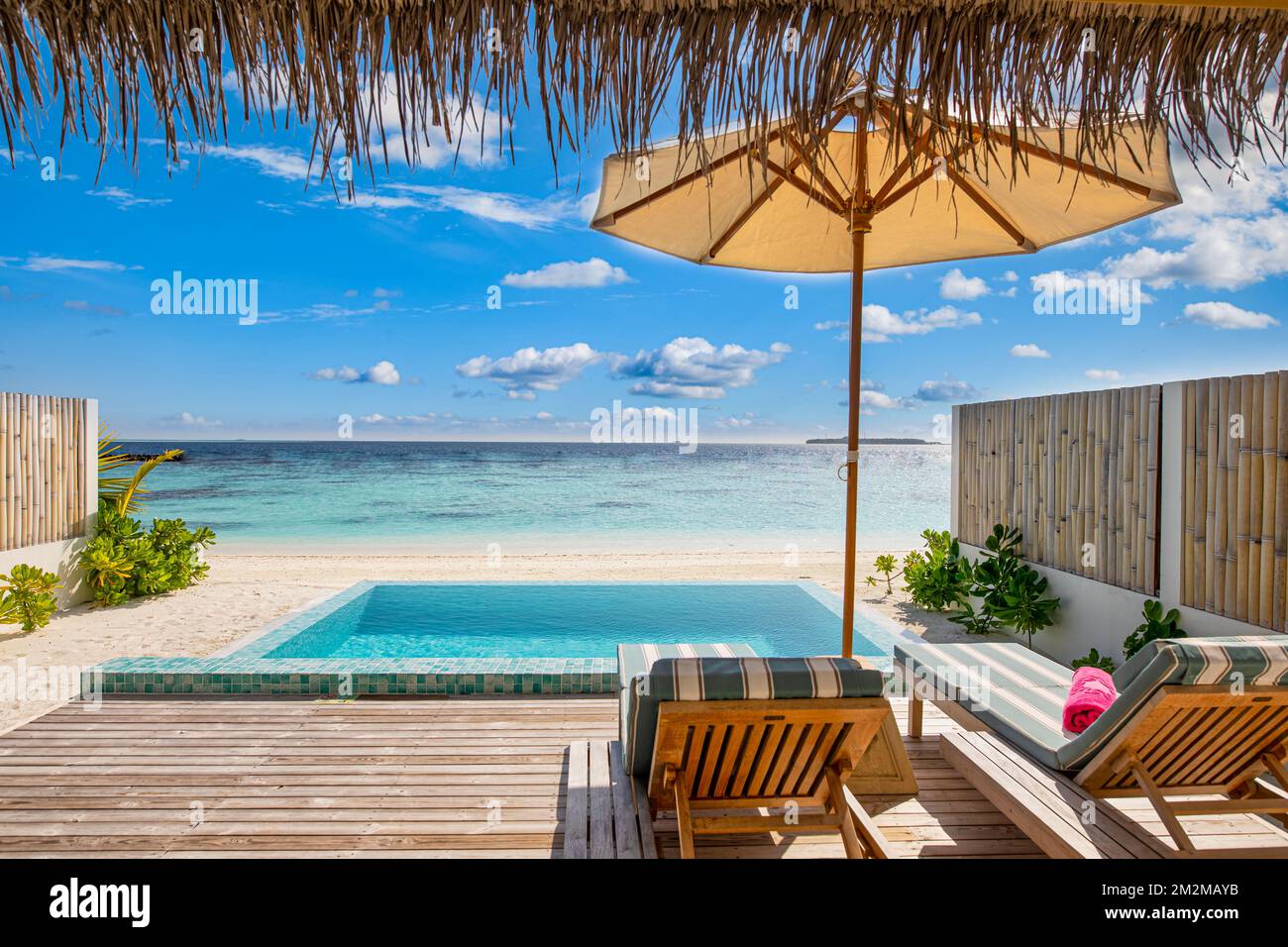 Image showcasing Beautiful poolside and blue sky beach. Luxurious tropical beach ...