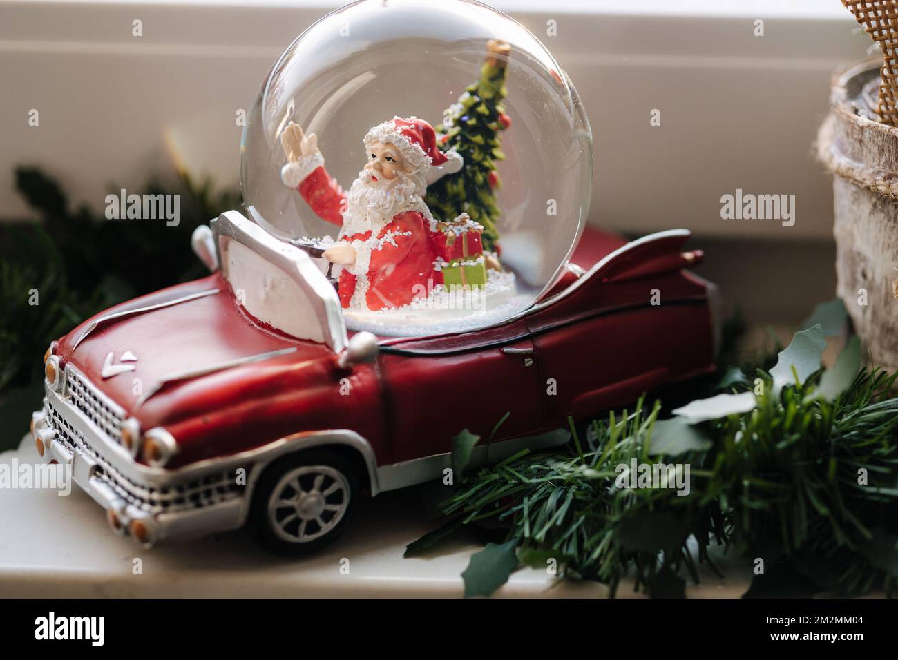 Santa in car, snow globe. Christmas decor Stock Photo