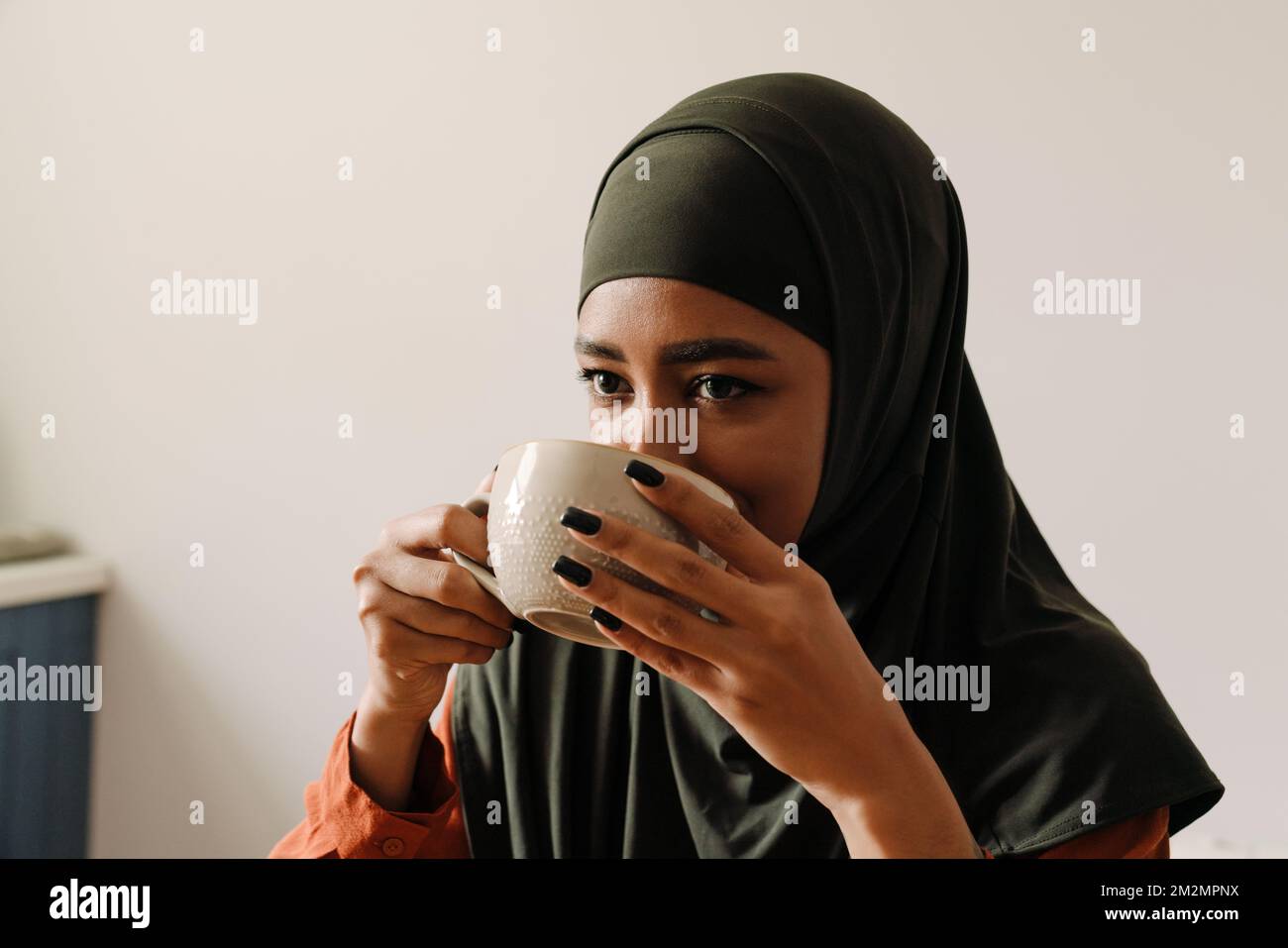 Hijab drinking hi-res stock photography and images - Alamy