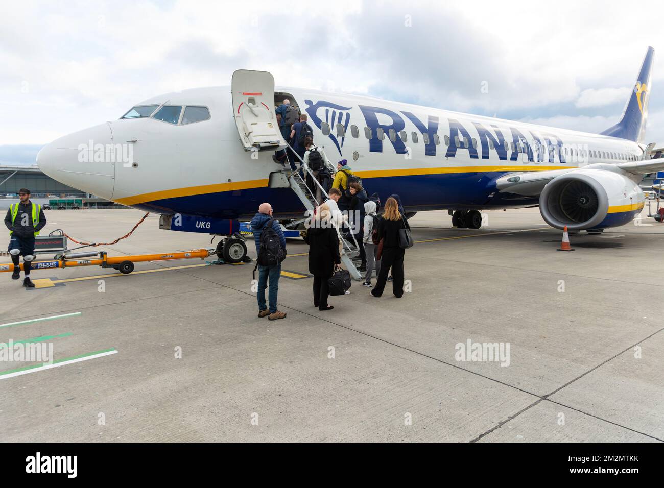 Passengers boarding Ryanair airline Boeing 737 plane, Stansted airport