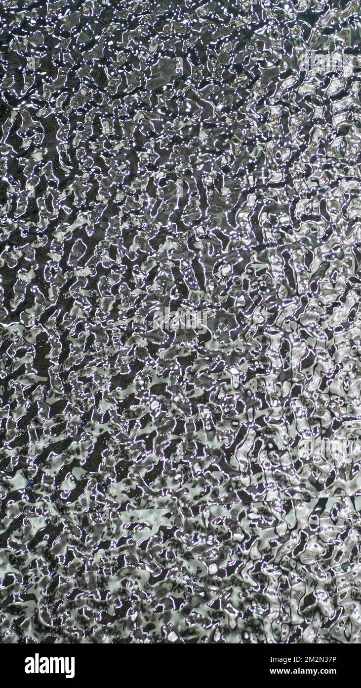 Background of molten metal, liquid steel closeup. Liquid metal texture