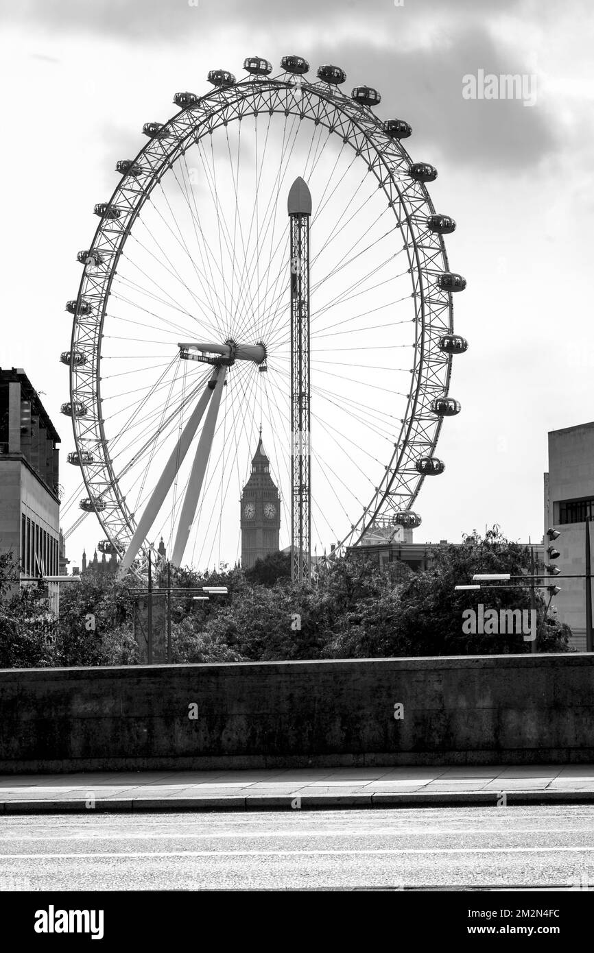 LONDON, GREAT BRITAIN - SEPTEMBER 7, 2014: This is a view of the London Eye and Big Ben from the Waterloo Bridge in black and white. Stock Photo