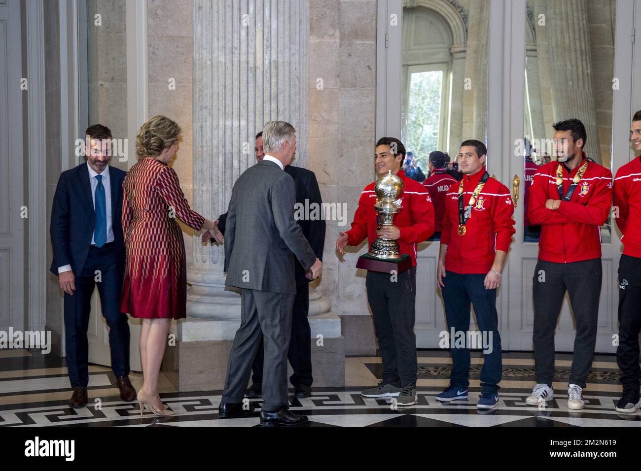 Queen Mathilde of Belgium, King Philippe - Filip of Belgium greet Belgian Hockey Federation chairman Marc Coudron, Belgian Hockey Federation Secretary-General Serge Pilet, Belgium's captain Thomas Briels, holding the World Cup trophy, Belgium's John-John Dohmen and Belgium's Simon Gougnard pictured during a reception to honour the new hockey world champions, the Belgian Red Lions team, in the Royal castle in Laken - Laeken, Tuesday 18 December 2018. Red Lions won 3-2 the final against The Netherlands in India last last Sunday. BELGA PHOTO HATIM KAGHAT Stock Photo