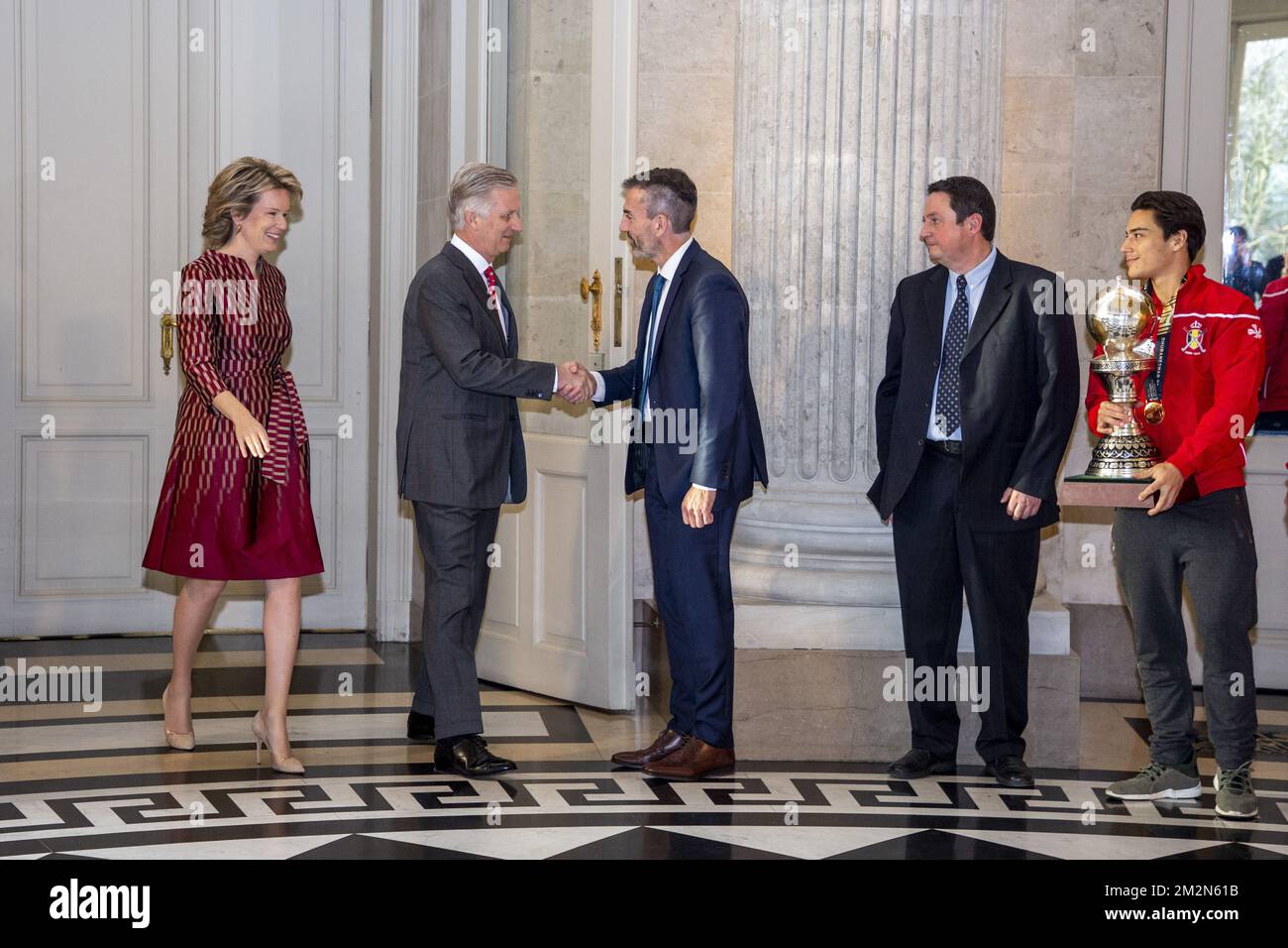 Queen Mathilde of Belgium, King Philippe - Filip of Belgium, Belgian Hockey Federation chairman Marc Coudron, Belgian Hockey Federation Secretary-General Serge Pilet and Belgium's captain Thomas Briels, holding the World Cup trophy, pictured during a reception to honour the new hockey world champions, the Belgian Red Lions team, in the Royal castle in Laken - Laeken, Tuesday 18 December 2018. Red Lions won 3-2 the final against The Netherlands in India last last Sunday. BELGA PHOTO HATIM KAGHAT Stock Photo