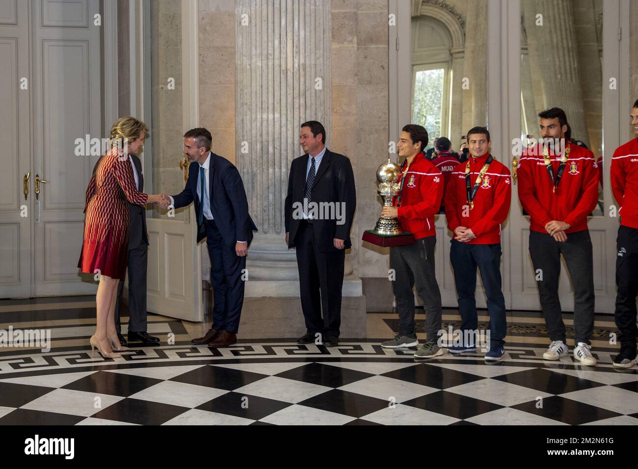 Queen Mathilde of Belgium, King Philippe - Filip of Belgium, Belgian Hockey Federation chairman Marc Coudron, Belgian Hockey Federation Secretary-General Serge Pilet, Belgium's captain Thomas Briels, holding the World Cup trophy, Belgium's John-John Dohmen and Belgium's Simon Gougnard pictured during a reception to honour the new hockey world champions, the Belgian Red Lions team, in the Royal castle in Laken - Laeken, Tuesday 18 December 2018. Red Lions won 3-2 the final against The Netherlands in India last last Sunday. BELGA PHOTO HATIM KAGHAT Stock Photo