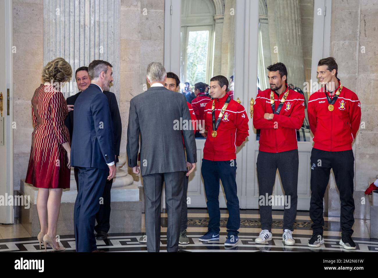 Queen Mathilde of Belgium, King Philippe - Filip of Belgium greet Belgian Hockey Federation chairman Marc Coudron, Belgian Hockey Federation Secretary-General Serge Pilet, Belgium's captain Thomas Briels, holding the World Cup trophy, Belgium's John-John Dohmen, Belgium's Simon Gougnard and Belgium's Felix Denayer pictured during a reception to honour the new hockey world champions, the Belgian Red Lions team, in the Royal castle in Laken - Laeken, Tuesday 18 December 2018. Red Lions won 3-2 the final against The Netherlands in India last last Sunday. BELGA PHOTO HATIM KAGHAT Stock Photo