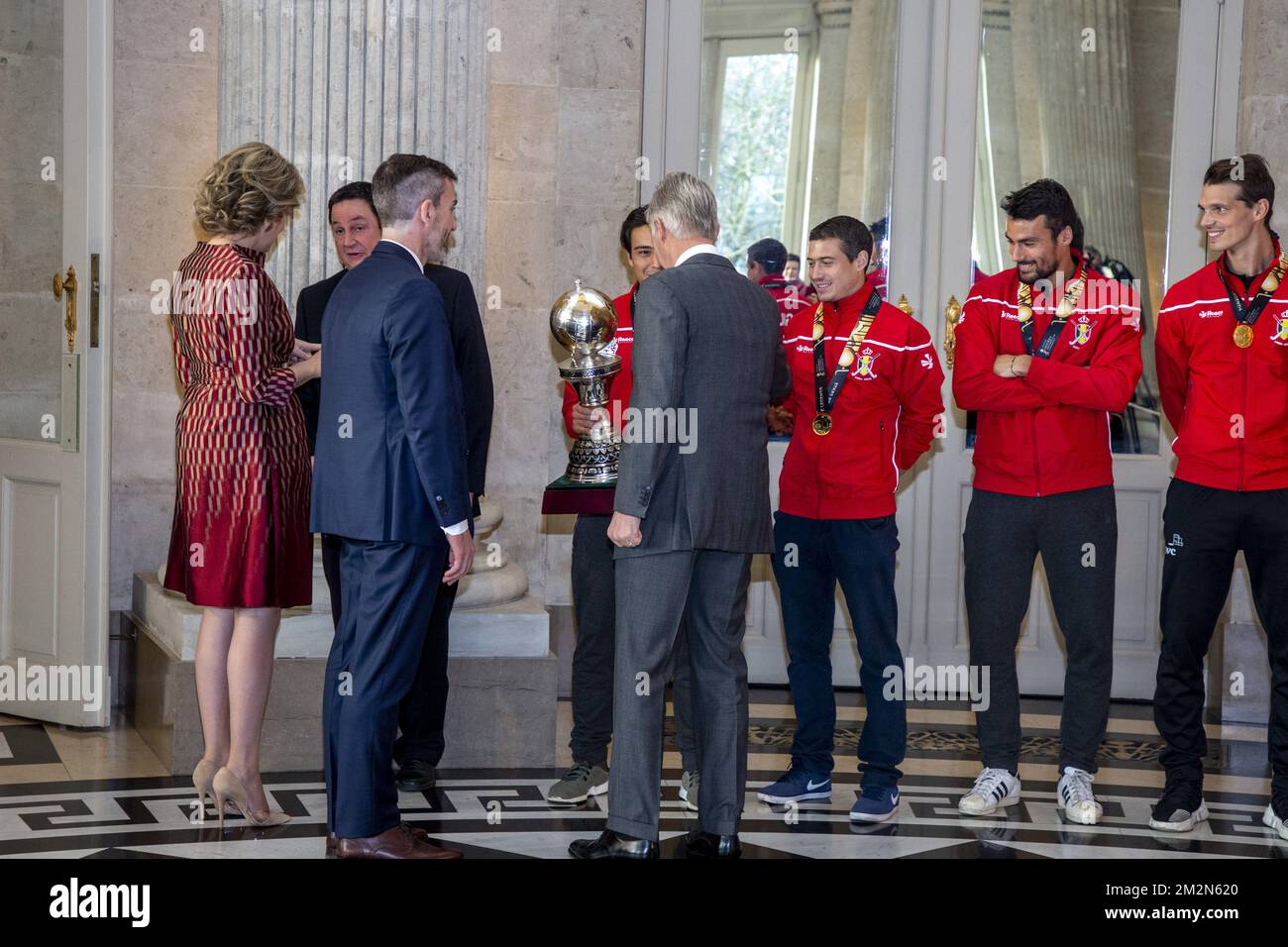 Queen Mathilde of Belgium, King Philippe - Filip of Belgium greet Belgian Hockey Federation chairman Marc Coudron, Belgian Hockey Federation Secretary-General Serge Pilet, Belgium's captain Thomas Briels, holding the World Cup trophy, Belgium's John-John Dohmen, Belgium's Simon Gougnard and Belgium's Felix Denayer pictured during a reception to honour the new hockey world champions, the Belgian Red Lions team, in the Royal castle in Laken - Laeken, Tuesday 18 December 2018. Red Lions won 3-2 the final against The Netherlands in India last last Sunday. BELGA PHOTO HATIM KAGHAT Stock Photo