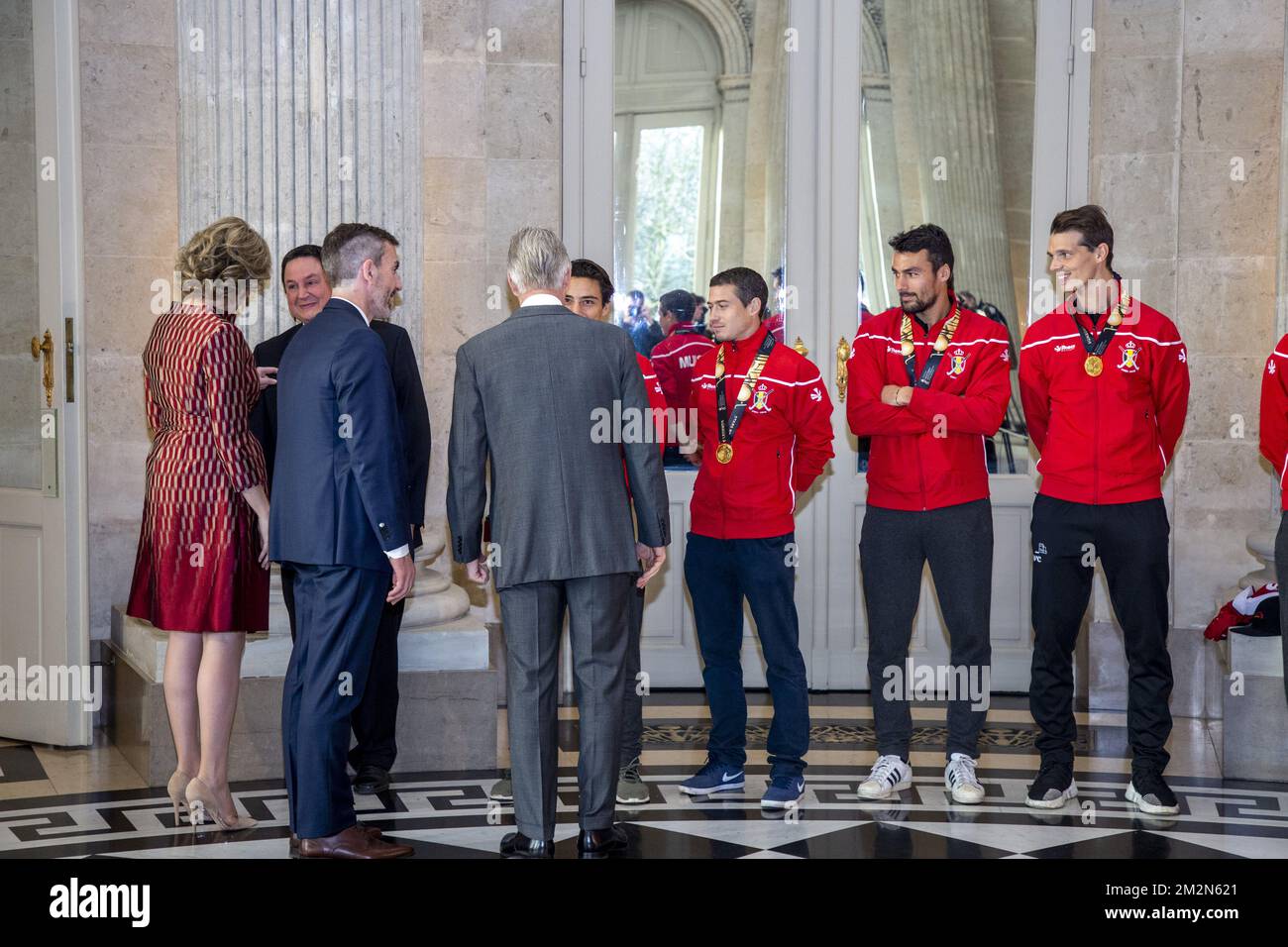 Queen Mathilde of Belgium, King Philippe - Filip of Belgium greet Belgian Hockey Federation chairman Marc Coudron, Belgian Hockey Federation Secretary-General Serge Pilet, Belgium's captain Thomas Briels, holding the World Cup trophy, Belgium's John-John Dohmen, Belgium's Simon Gougnard and Belgium's Felix Denayer pictured during a reception to honour the new hockey world champions, the Belgian Red Lions team, in the Royal castle in Laken - Laeken, Tuesday 18 December 2018. Red Lions won 3-2 the final against The Netherlands in India last last Sunday. BELGA PHOTO HATIM KAGHAT Stock Photo