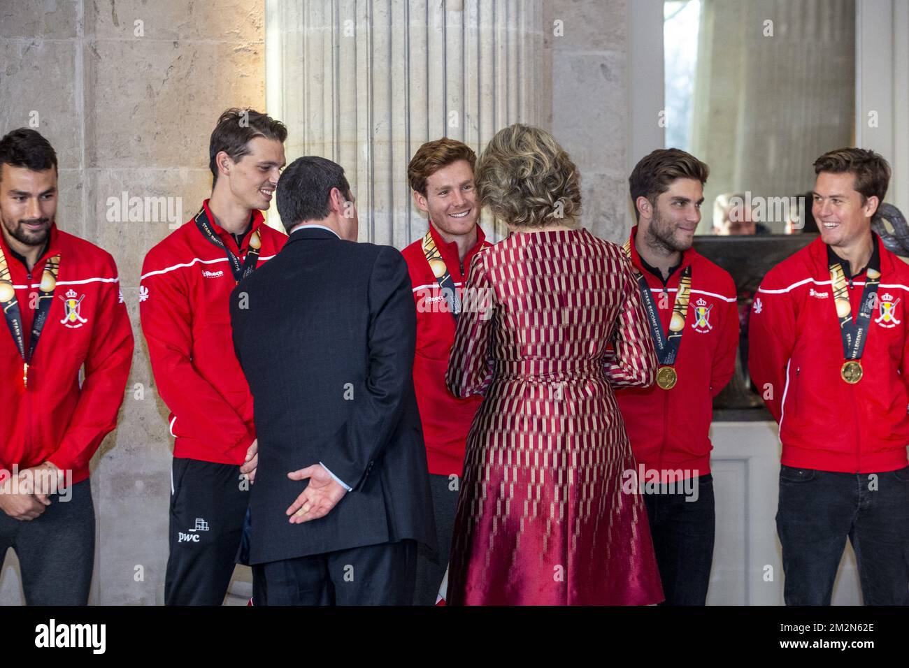 Belgium's Simon Gougnard, Belgium's Felix Denayer, Belgium's Gauthier Boccard, Belgium's Cedric Charlier, Belgium's Tom Boon, Belgian Hockey Federation Secretary-General Serge Pilet and Queen Mathilde of Belgium pictured during a reception to honour the new hockey world champions, the Belgian Red Lions team, in the Royal castle in Laken - Laeken, Tuesday 18 December 2018. Red Lions won 3-2 the final against The Netherlands in India last last Sunday. BELGA PHOTO HATIM KAGHAT Stock Photo