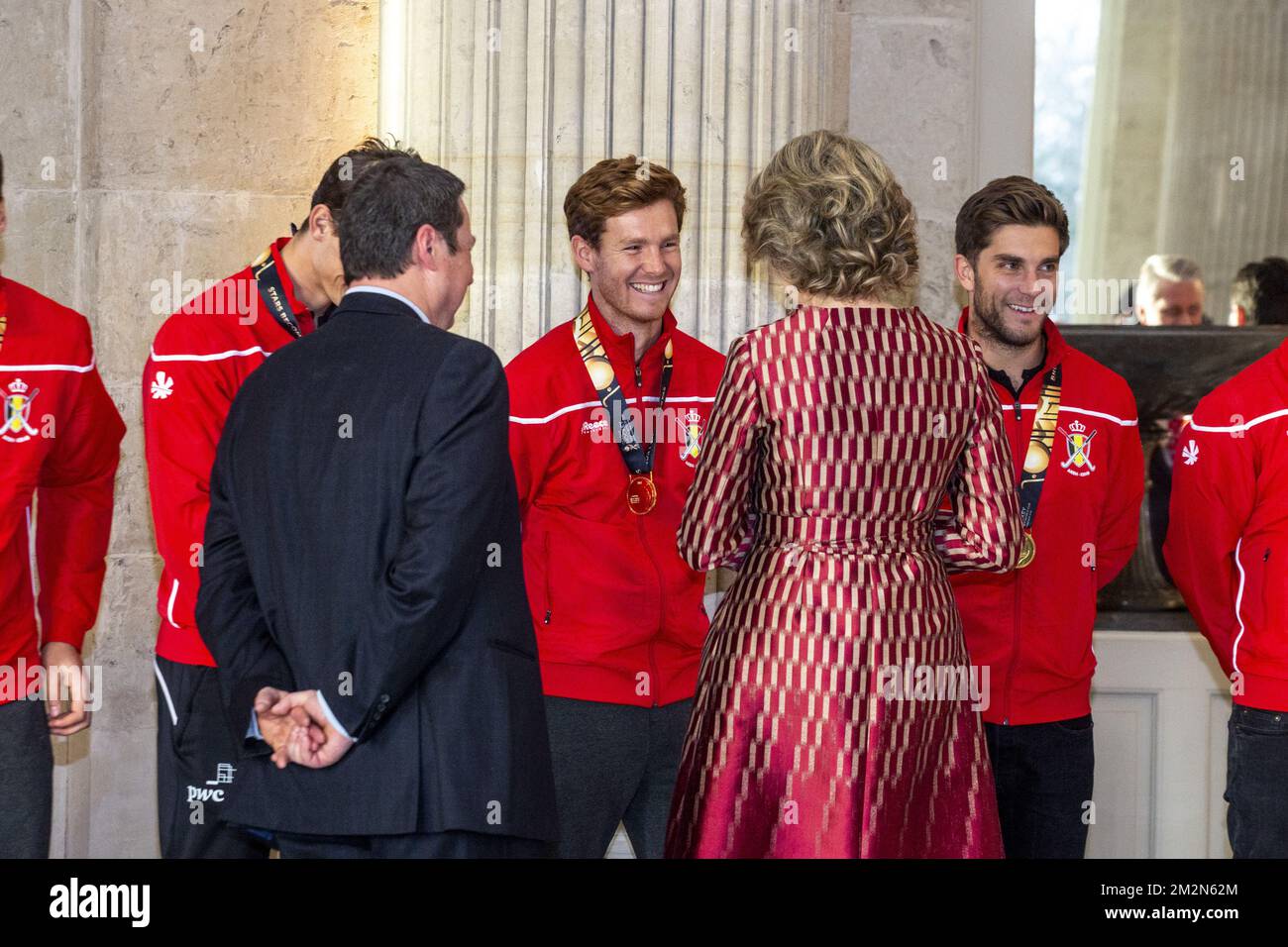 Belgium's Gauthier Boccard, Belgian Hockey Federation Secretary-General Serge Pilet, Queen Mathilde of Belgium and Belgium's Cedric Charlier pictured during a reception to honour the new hockey world champions, the Belgian Red Lions team, in the Royal castle in Laken - Laeken, Tuesday 18 December 2018. Red Lions won 3-2 the final against The Netherlands in India last last Sunday. BELGA PHOTO HATIM KAGHAT Stock Photo