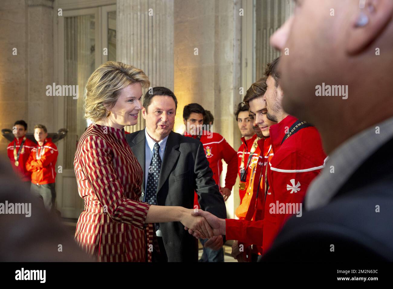 Queen Mathilde of Belgium and Belgian Hockey Federation Secretary-General Serge Pilet pictured during a reception to honour the new hockey world champions, the Belgian Red Lions team, in the Royal castle in Laken - Laeken, Tuesday 18 December 2018. Red Lions won 3-2 the final against The Netherlands in India last last Sunday. BELGA PHOTO HATIM KAGHAT Stock Photo