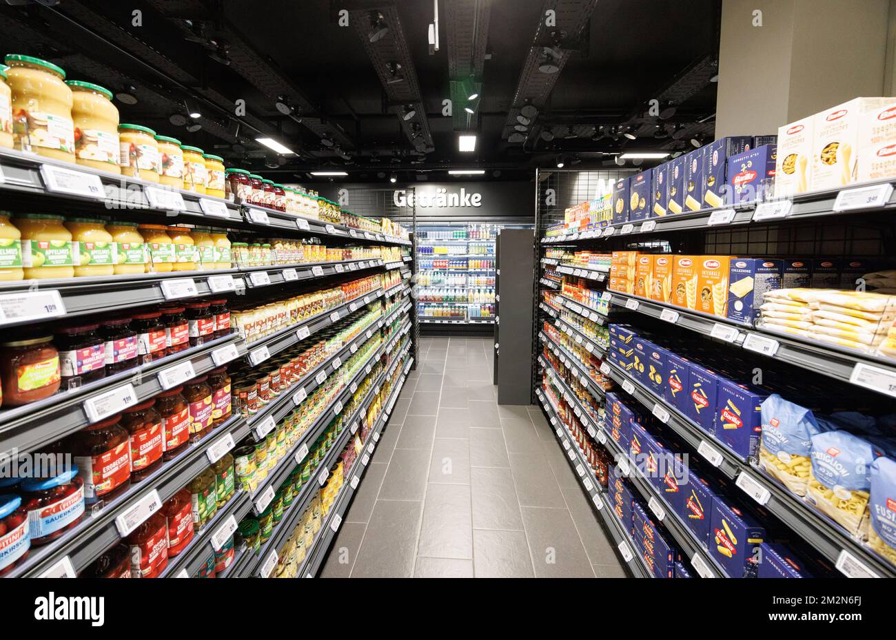 Munich, Germany. 14th Dec, 2022. Shelves of groceries stand in the