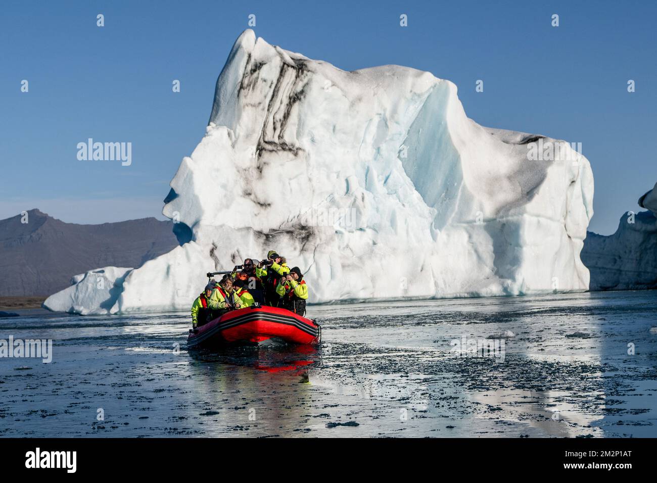 October 19, 2022, JÃ¶kulsÃrlÃ³n, JÃ¶kulsÃrlÃ³n, Iceland: A boat is seen sailing near icebergs floating in JÃ¶kulsÃrlÃ³n. JÃ¶kulsÃrlÃ³n is a lake located in southern Iceland, with an area of 20 km2 and a depth of over 200 meters. Until less than 100 years ago, the BreiÃ°amerkurjÃ¶kull glacier (part of the VatnajÃ¶kull glacier) extended even beyond the ring road. Due to rising temperatures, the glacier has retreated, creating this impressive glacial lagoon. (Credit Image: © Jorge Castellanos/SOPA Images via ZUMA Press Wire) Stock Photo