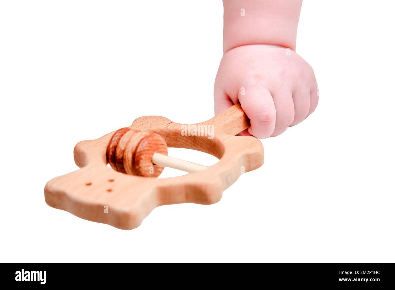 Baby hand and toy rattle abacus, close-up, isolated on a white ...