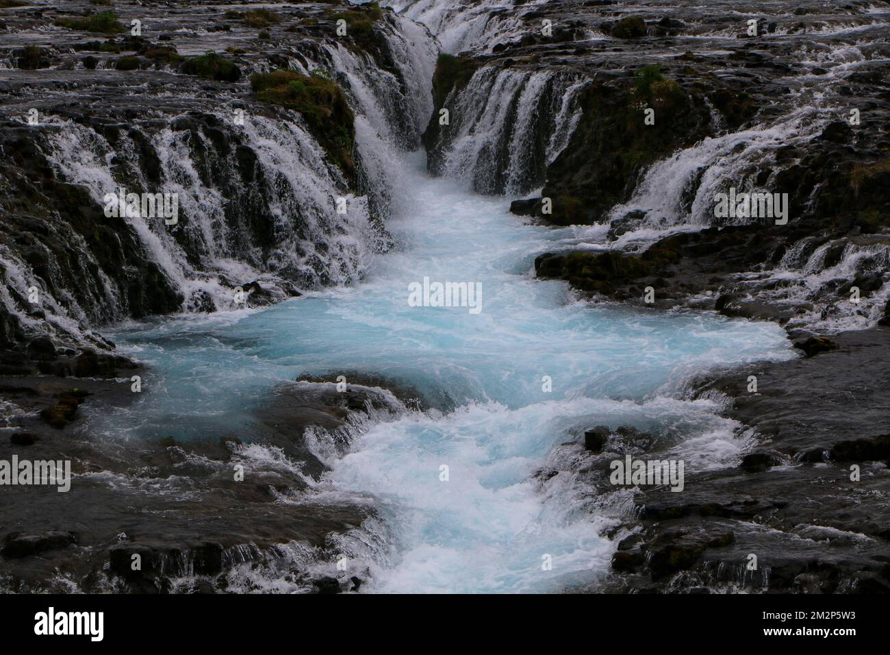 A beautiful scenery of the flowing Bruarfoss waterfall on the Bruara River in Iceland Stock Photo