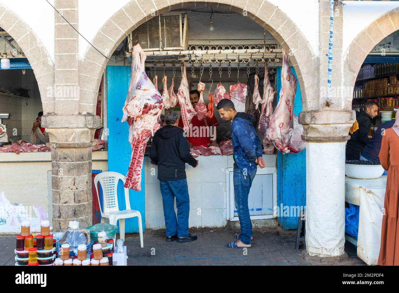 Meat hanging on hook at butcher shop in medina area of Essaouira, Morocco, north Africa Stock Photo