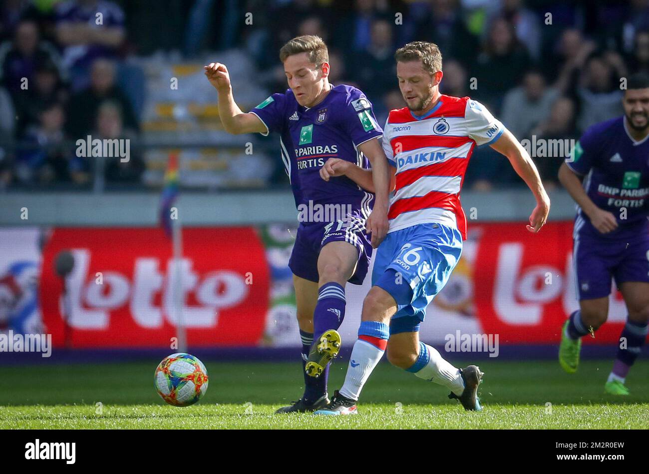 Anderlecht s Yari Verschaeren and Club s Mats Rits fight for the