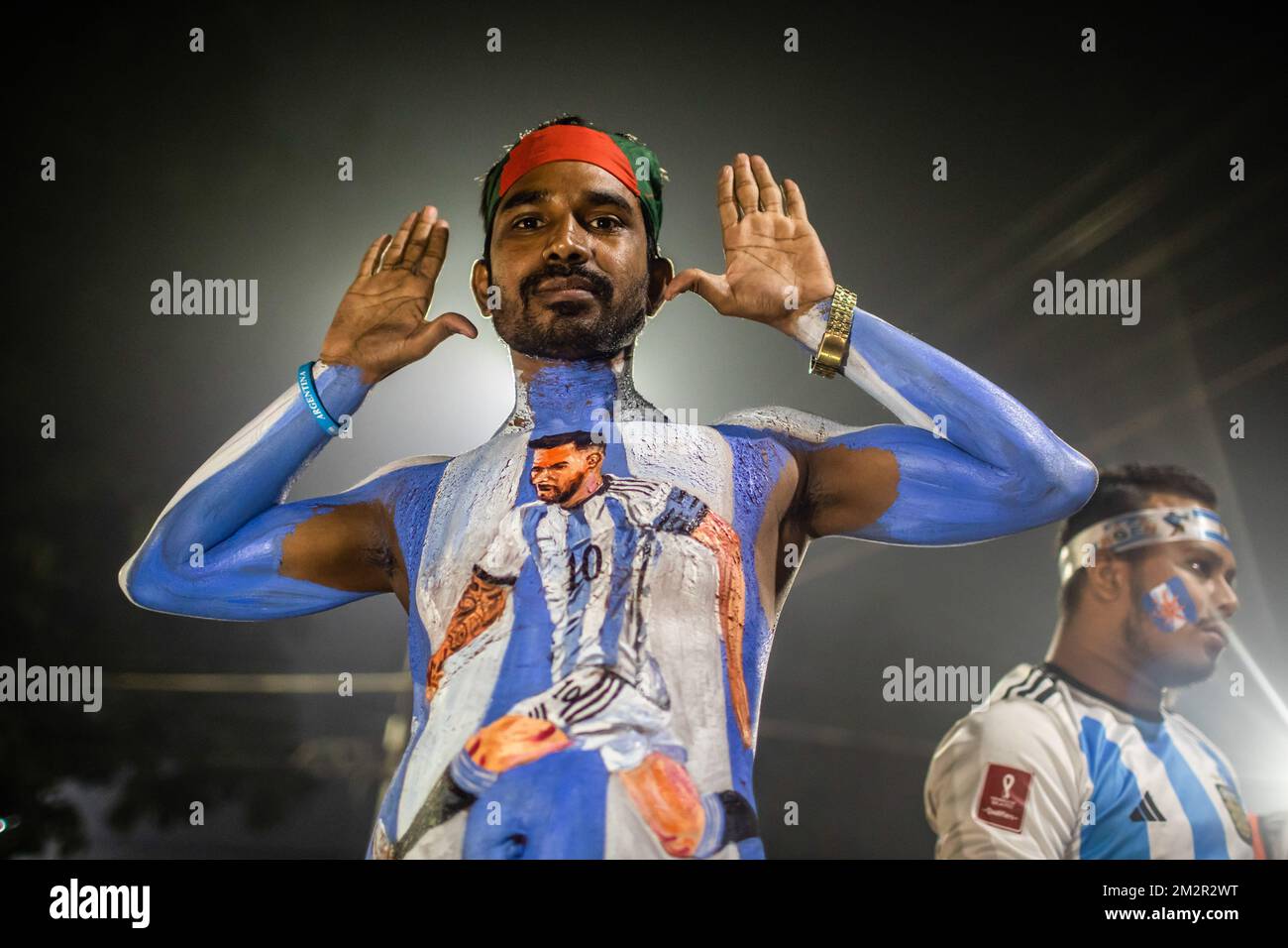 Dhaka, Bangladesh. 14th Dec, 2022. An Argentina soccer fan seen with paint on his body watches the live stream match between Argentina and Croatia at the World Cup. The Argentinian team, led by Messi, beat Croatia 3-0, qualifying for the finals, for the first time since 2014. (Photo by Sazzad Hossain/SOPA Images/Sipa USA) Credit: Sipa USA/Alamy Live News Stock Photo