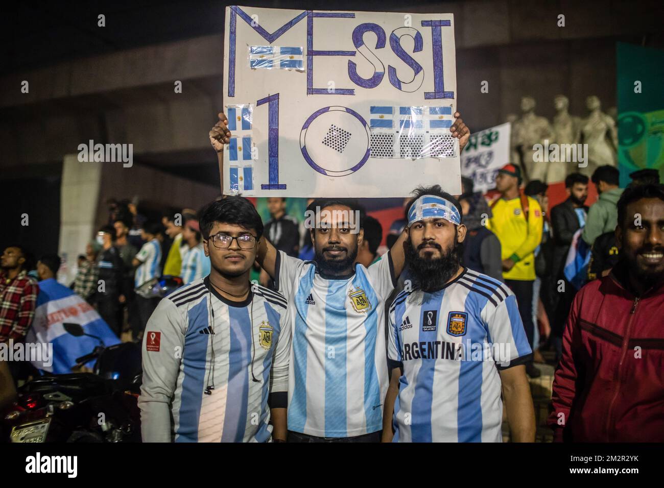 Dhaka, Bangladesh. 14th Dec, 2022. Argentina soccer fans holds up a placard and celebrate their match against Croatia at the World Cup. The Argentinian team, led by Messi, beat Croatia 3-0, qualifying for the finals, for the first time since 2014. (Photo by Sazzad Hossain/SOPA Images/Sipa USA) Credit: Sipa USA/Alamy Live News Stock Photo
