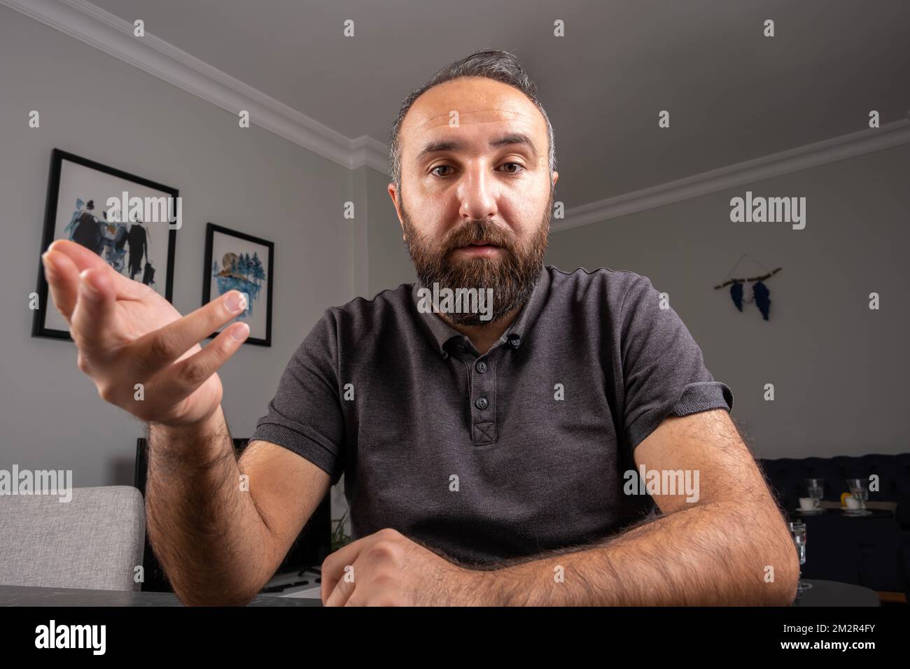 Young business man working from home web cam view. Talk on notebook camera having video call or conversation with client, virtual distance meeting. Stock Photo