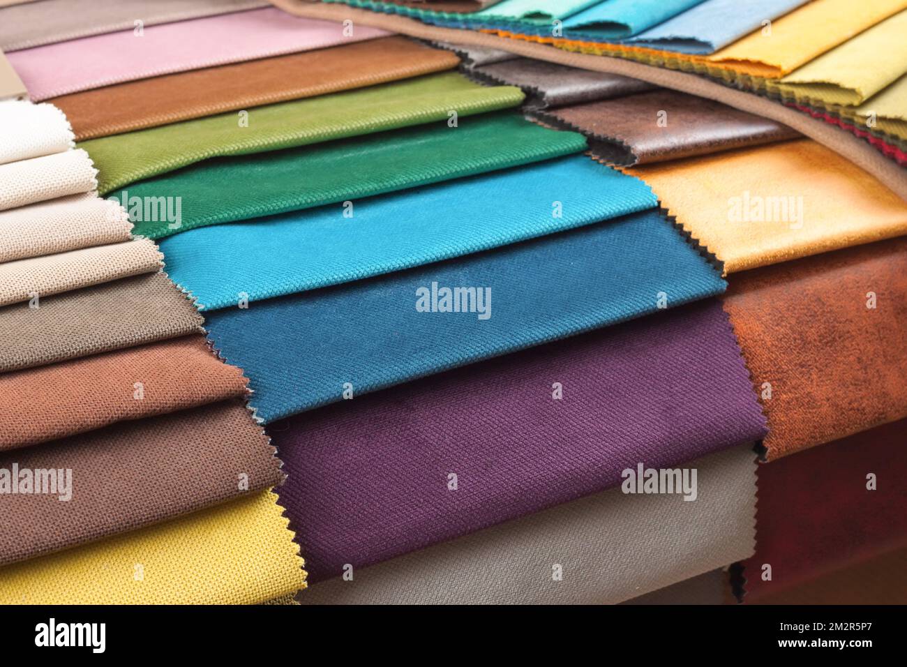 Color samples of the upholstery fabric in the assortment. palette of fabrics of various colors Stock Photo