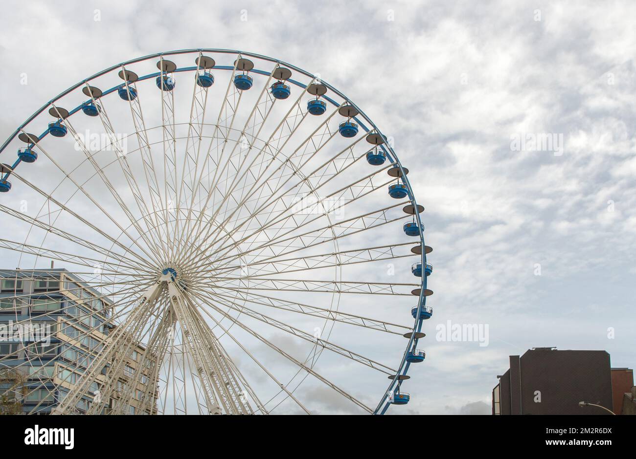 Ferris wheel located in the city. Copy space, autumn sky Stock Photo