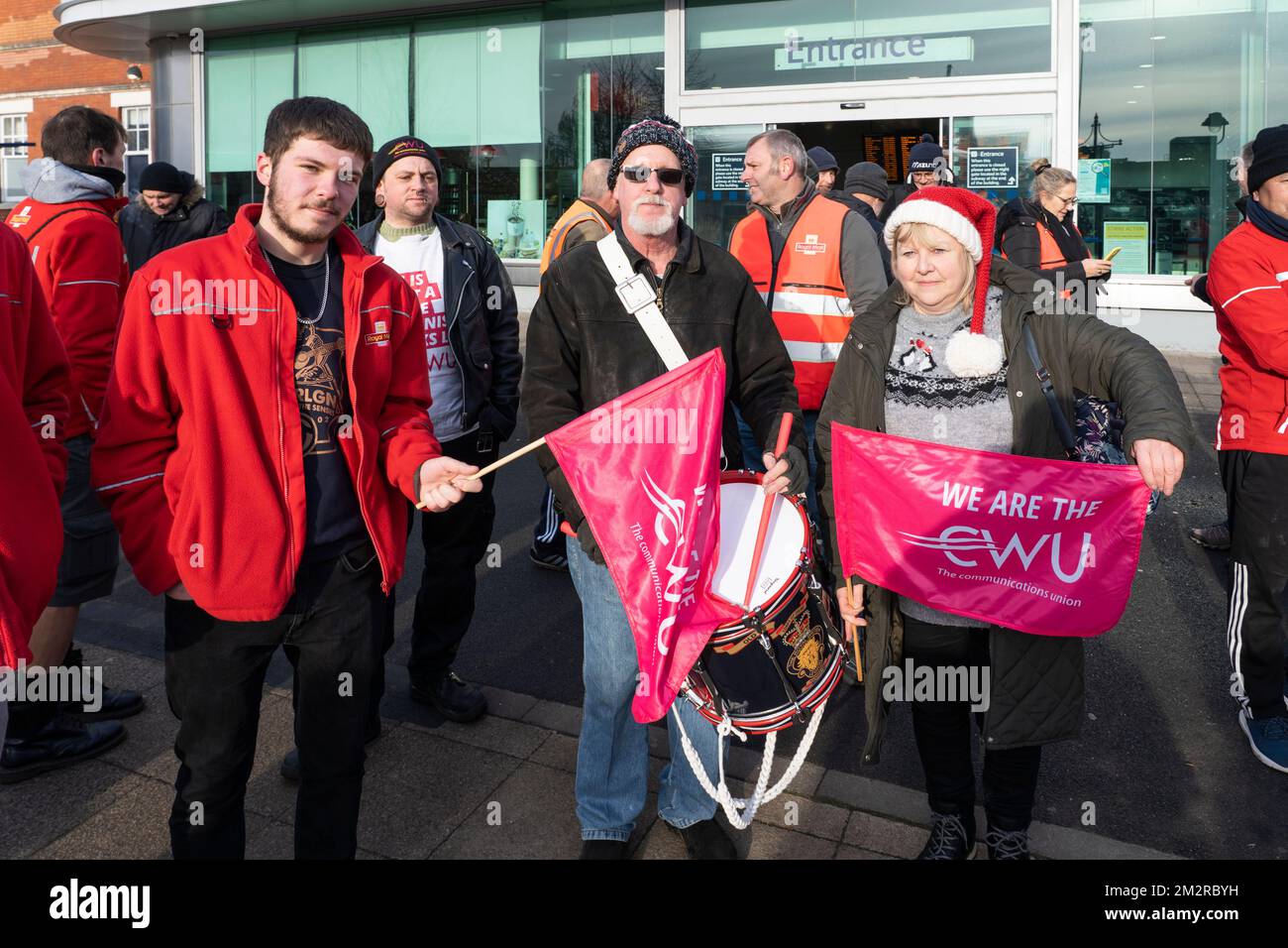 Basingstoke, UK. 14th Dec 2022. Royal mail postal workers on strike at Basingstoke train station, having marched from the Priestley Road Royal Mail Basingstoke Delivery Office. Part of national strike action called for by the CWU (Communication Workers Union) which is attempting to negotiate a settlement with Royal Mail Group. Credit: Stephen Frost/Alamy Live News Stock Photo