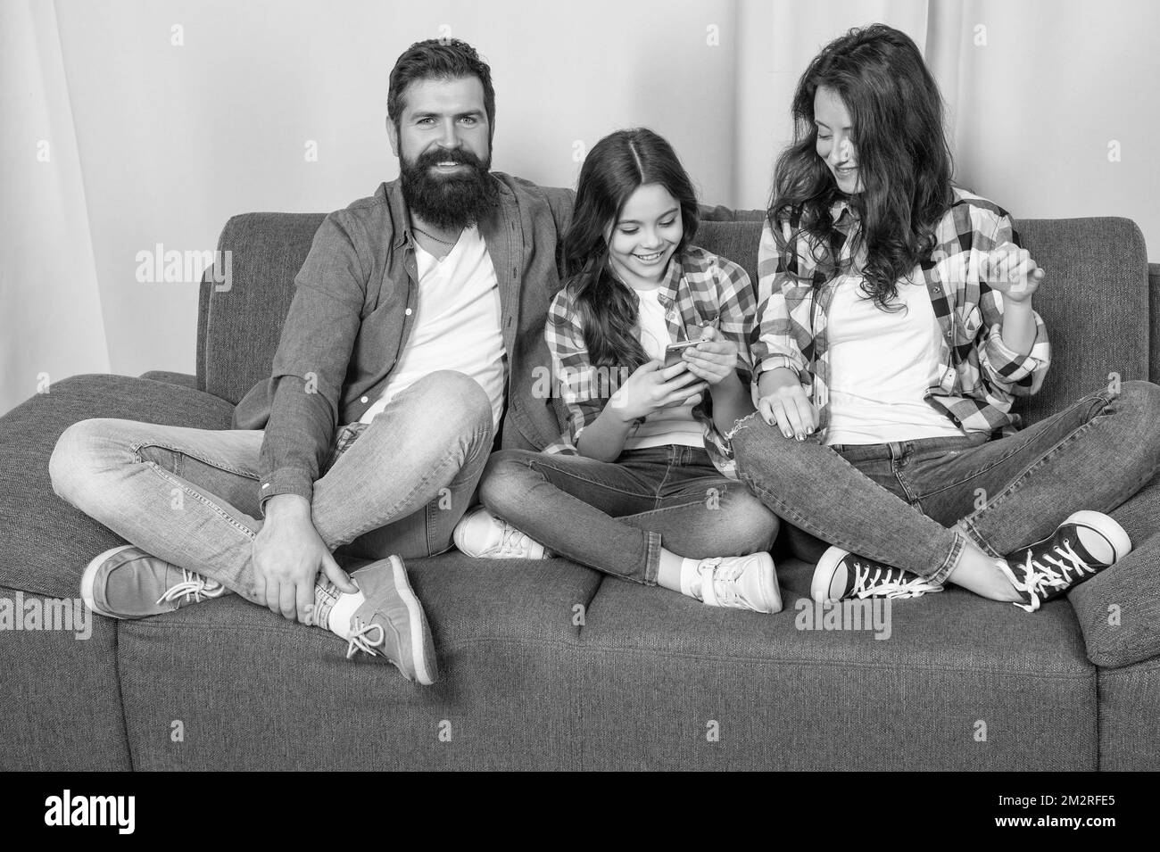Man sofa mobile Black and White Stock Photos & Images - Page 2 - Alamy