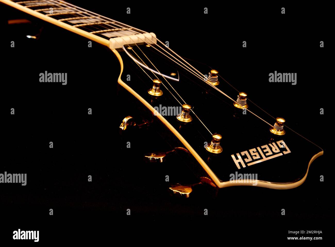 Den Helder, Netherlands. December 2022. The neck of a Gretsch guitar in black and white. High
