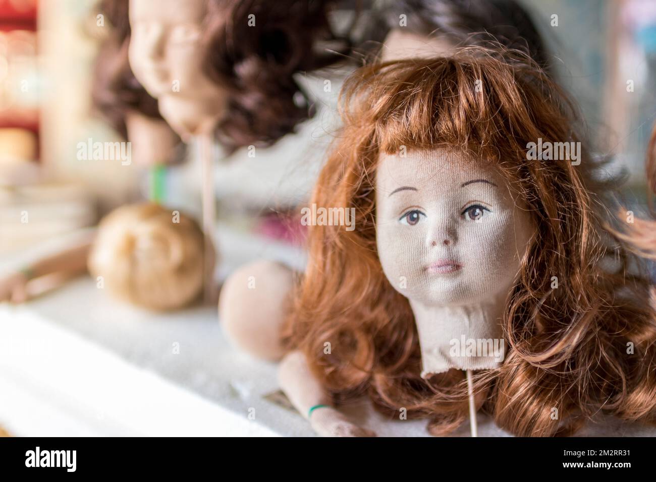 A head of a doll being created by a doll maker Stock Photo Alamy