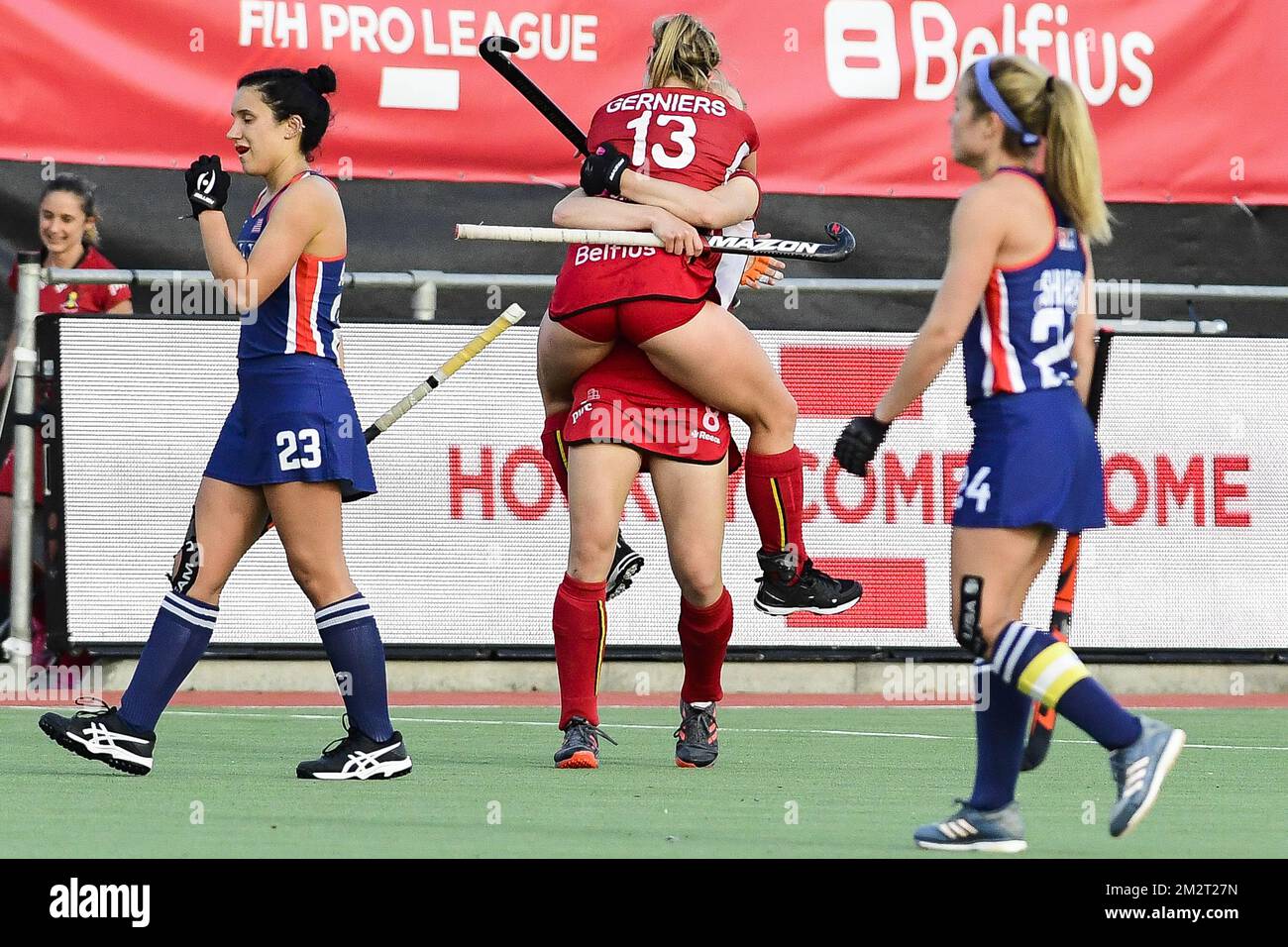 Belgium's Alix Gerniers and Belgium's Emma Puvrez celebrate after winning a field hockey game
