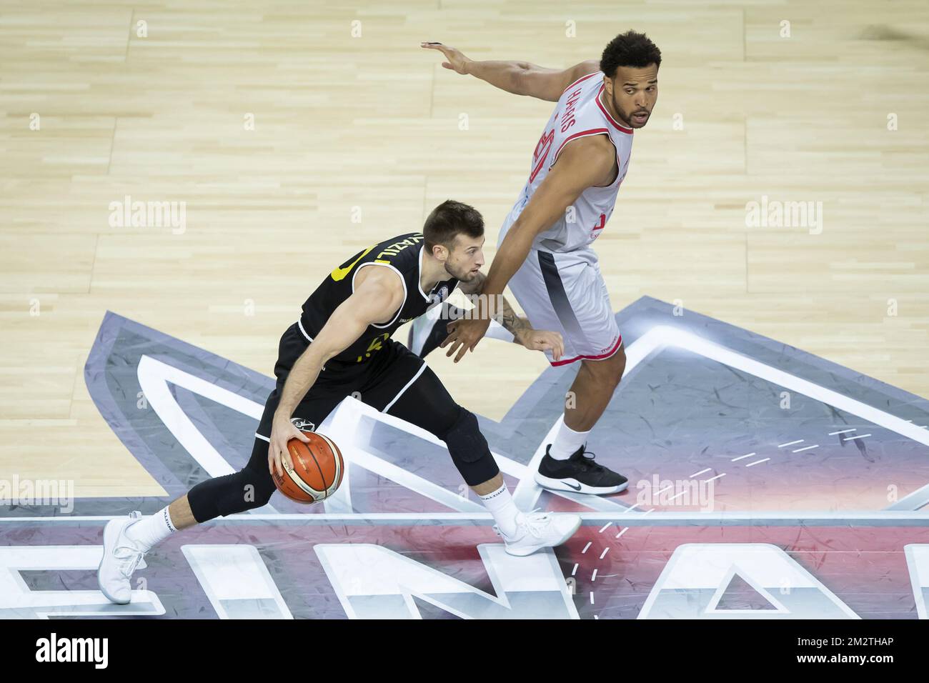 Antwerp's Thomas Akyazili and Bamberg's Elias Harris pictured in action during a basketball