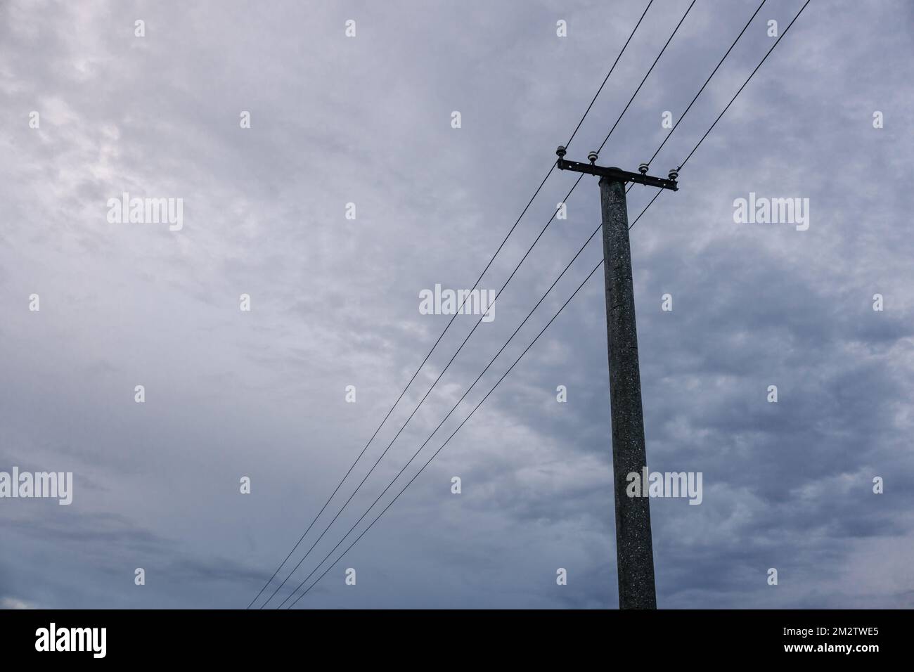 A transmission tower and cloudy sky Stock Photo - Alamy