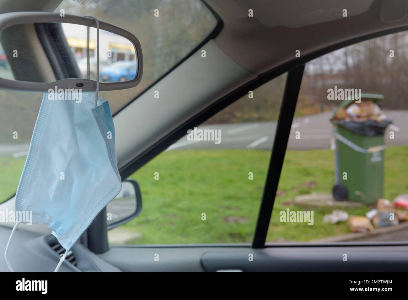 Overflowing garbage cans in parking lots. Too much garbage on the