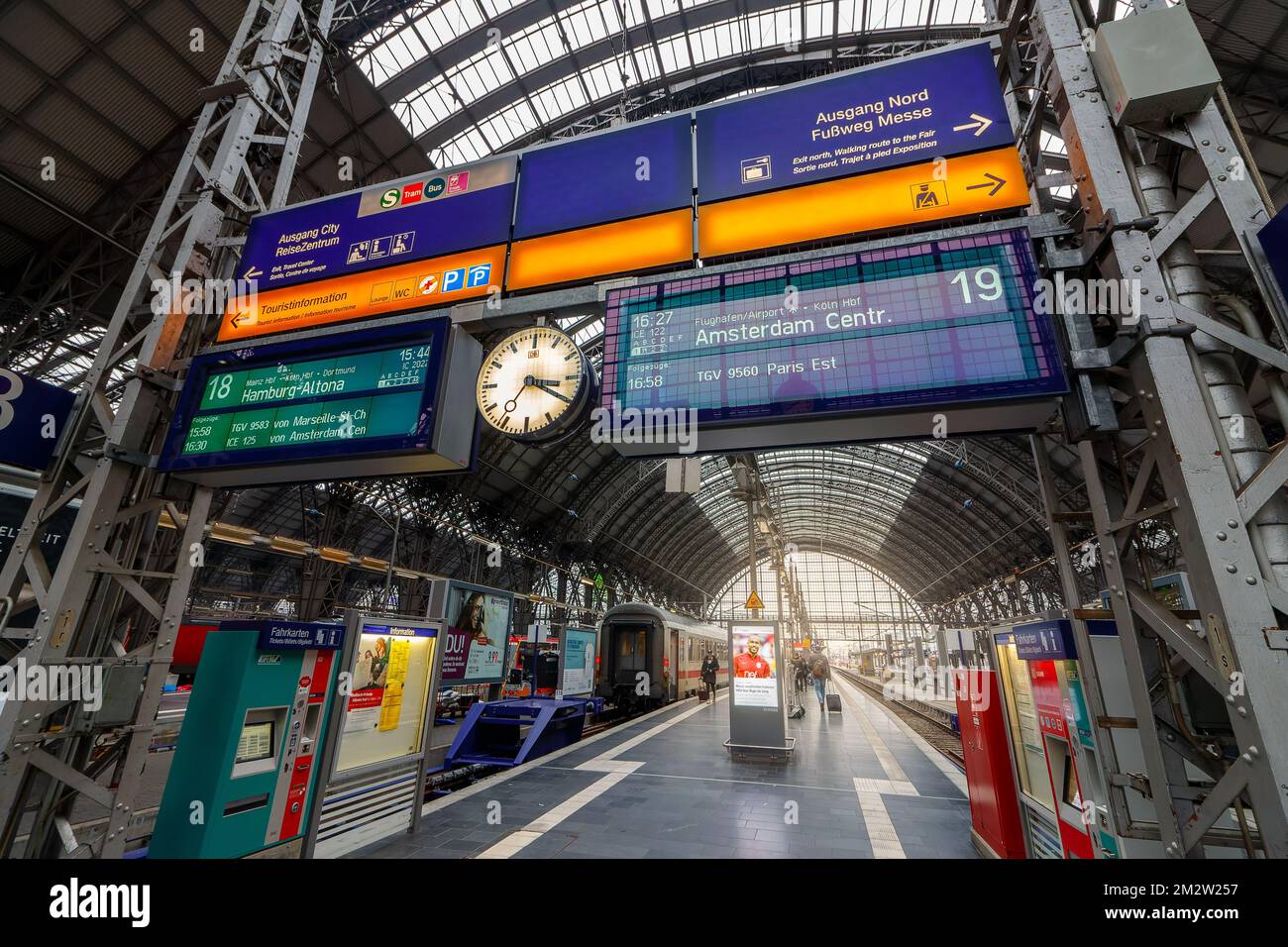 The Frankfurt main station with signs for changing trains to Amsterdam and to Hamburg Stock