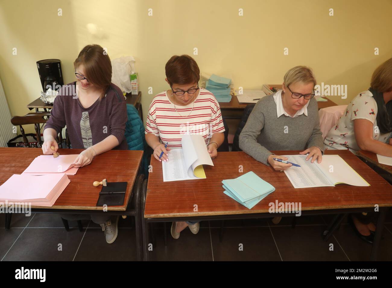 Members of the 'bureau de vote' check lists at the start of the vote, at a polling station in Montigny-le-Tilleul, Sunday 26 May 2019. Belgium holds regional, federal and European elections on Sunday. BELGA PHOTO BRUNO FAHY  Stock Photo