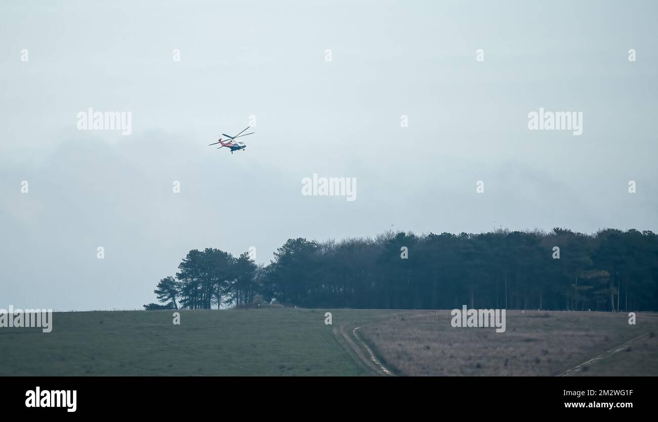 G-ETPP AugustaWestland AW139 training helicopter flying low on a military exercise, Wiltshire UK Stock Photo